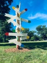 colorful directional signs, art scuplture, follow the road less travelled, inspiration