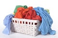 Colorful dirty clothes in laundry basket Royalty Free Stock Photo