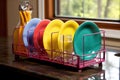 colorful dish rack with freshly washed dishes