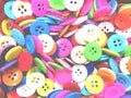 Colorful disorderly sewing buttons background with soft light