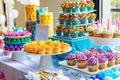 A colorful display of cupcakes and sweets at a festive party table setup Royalty Free Stock Photo