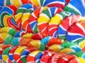 Colorful display of rainbow lollipop candies