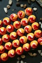 Colorful Display: Table Covered in Red and Yellow Marbles Royalty Free Stock Photo