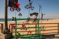 Colorful display of wind spinners that were being sold on the Huntington Beach Pier with the beach and ocean in the background Royalty Free Stock Photo