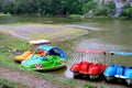 Colorful docked pedal boats on a lake. Royalty Free Stock Photo