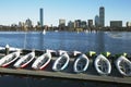 Colorful docked sailboats and Boston Skyline in winter on half frozen Charles River, Massachusetts, USA Royalty Free Stock Photo