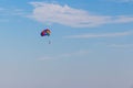 A colorful dome of a parachute in a blue sky Royalty Free Stock Photo