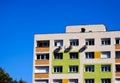 colorful condominium building elevation detail. Windows and wall installed air-conditioning condensing units