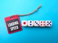 Colorful domino game with the words "loading speed" in front of it, set against a blue background