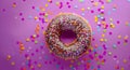 Colorful Donut with Sprinkles on Purple Background Royalty Free Stock Photo