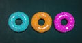 Colorful donuts assorted donuts with chocolate frosted, pink glazed and sprinkles donuts Royalty Free Stock Photo