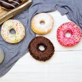 Colorful donuts with chocolate and icing, selective focus
