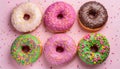 Colorful donuts on pink background. Flat lay