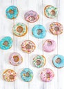 Colorful Donuts turquoise and pink, pattern. Donuts Set on White Background. Doughnuts with multi colored glaze. Doughnuts