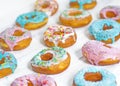 Colorful Donuts turquoise and pink, pattern. Donuts Set on White Background. Doughnuts with multi colored glaze. Doughnuts