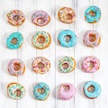 Colorful Donuts turquoise and pink, pattern. Donuts Set on White Background. Doughnuts with multi colored glaze. Doughnuts