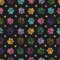 Colorful doodle paw print seamless fabric design black