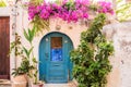 Colorful doorway in Greece with beautiful flowers Royalty Free Stock Photo