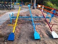 Colorful downed trees on the playground.