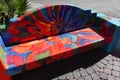 Colorful downtown sidewalk bench Royalty Free Stock Photo