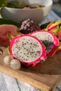 Colorful dragon fruit and peeled lychees, tasty tropical exotic fruits close up