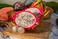 Colorful dragon fruit and peeled lychees, tasty tropical exotic fruits close up