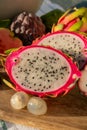 Colorful dragon fruit and peeled lychees, tasty tropical exotic fruits