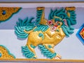 Colorful dragon relief in Dharamsala