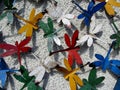 Colorful dragonflies made out of paint cans