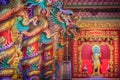 Colorful dragons and statue of Nezha, the protective deity in Ch