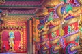 Colorful dragons and statue of Nezha, the protective deity in Ch