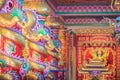 Colorful dragons and statue of Nezha, the protective deity in Ch