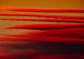 Colorful dramatic fiery orange red clouds