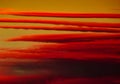 Colorful dramatic fiery orange red clouds