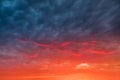dramatic sunset with red tinted clouds. Sky Background or texture Royalty Free Stock Photo