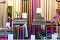 The colorful drapery shop window with fabric rolls and stacks of different shapes and colors Royalty Free Stock Photo