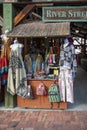 Colorful dresses, shirts and pants on display at a storefront in The River Street Market Place on River Street