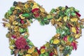 Colorful dried flowers shaped like a heart used as wallpaper Royalty Free Stock Photo