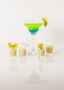 Colorful drink in a margarita glass, blue and green combination, many drinks in a shotglass Royalty Free Stock Photo