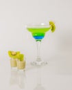 Colorful drink in a margarita glass, blue and green combination, many drinks in a shotglass Royalty Free Stock Photo