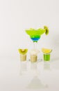 Colorful drink in a margarita glass, blue and green combination, many drinks in a shotglass Royalty Free Stock Photo