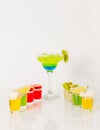 Colorful drink in a margarita glass, blue and green combination, many drinks in a shotglass Royalty Free Stock Photo