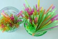 Colorful drinking straws for celebrations in green and clear glass Royalty Free Stock Photo