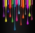 Colorful drops of nail polish drip from brushes close-up on black background