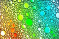 Colorful drops of oil on the water. Circles and ovals. Abstract bright backdrop for design