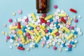 Colorful Drug Pills On Blue Background, Pharmaceutical Concept