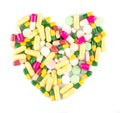 Colorful drug pills in shape of heart