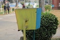 A colorful  dustbin alongside road Royalty Free Stock Photo