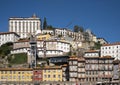 Colorful dwellings and an elevator along the Douro River in the Ribeira neighborhood of Porto, Portugal.