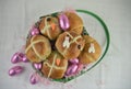 Easter breakfast with fresh hot cross buns and croissants with decorations